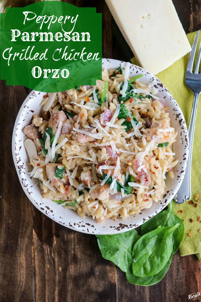 Peppery Parmesan Grilled Chicken Orzo is a bold and flavorful dish. Cooked with homemade broth and a dash of wine all in one skillet except the chicken, this dish is on the table in 30 minutes #pasta #orzo #grilledchicken #chicken #parmesan #babyspinach #redpepperflakes #cookingwithwine #karylskulinarykrusade