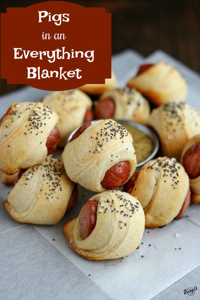 close up shot of pigs in a blanket on white parchment paper