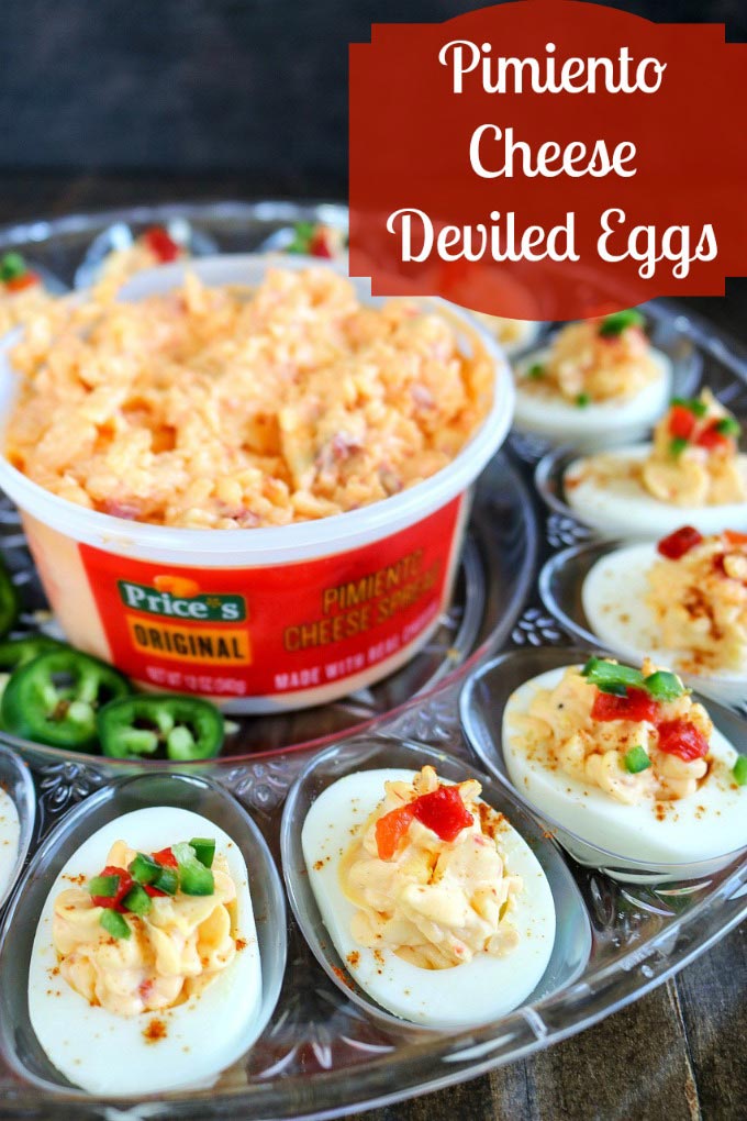 Pimiento Cheese Deviled Eggs will become your new favorite summer party snack! Price*s Pimiento Cheese Spread is a tradition worth sharing with your friends and loved ones, adding a wonderful new flavor dimension to the traditional deviled egg. Finish with diced pimiento peppers plus diced jalapenos for a delicious kick #Ad #pricestradition #pimientiocheesespread #pimientocheese #summerentertaining #deviledeggs 