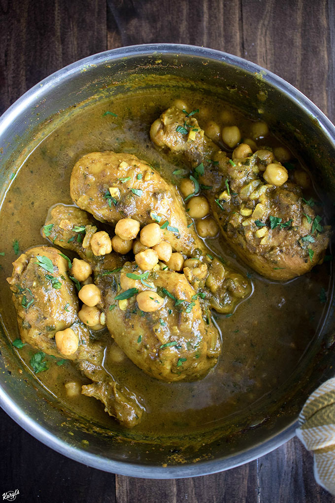 Curry Chicken and Chickpeas is traditional dish in Trinidad & Tobago. Madras curry powder provides the base of this bold and flavorful meal. Serve over rice or with roti bread to soak up every drop of gravy #chicken #curry #madrascurry #chickpeas #gravy #comfortfood #karylskulinarykrusade