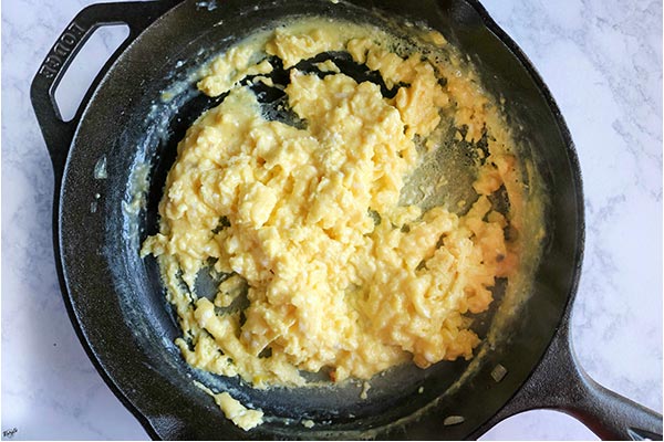 overhead process shot: eggs in a skillet