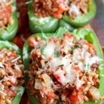close up shot of Farro Sausage Stuffed Peppers in a baking dish