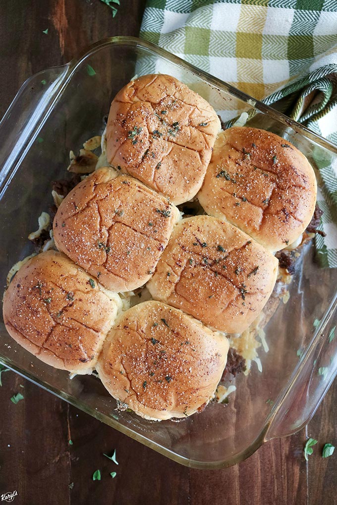 Overhead shot of a baking dish with finished French Onion Beef Sliders